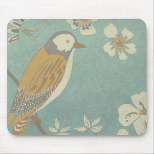 Gelber, grauer und beige Vogel gehockt auf einer Mousepad