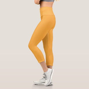 gelber Hintergrund mit schwarzer Grenze Capri Leggings