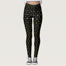 Gelber Tupfen auf schwarzen Leggings