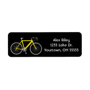 Gelbes Fahrrad auf schwarzem Etikett