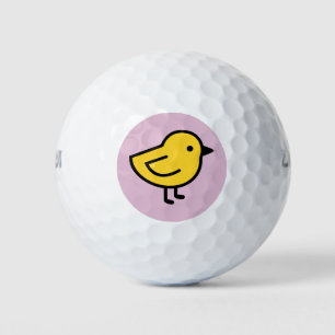 Gelbes Küken auf Rosa Golfball
