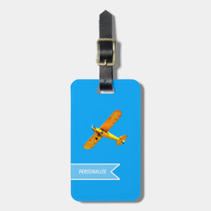 Gelbes Retro Flyer-Flugzeug mit Namen Gepäckanhänger