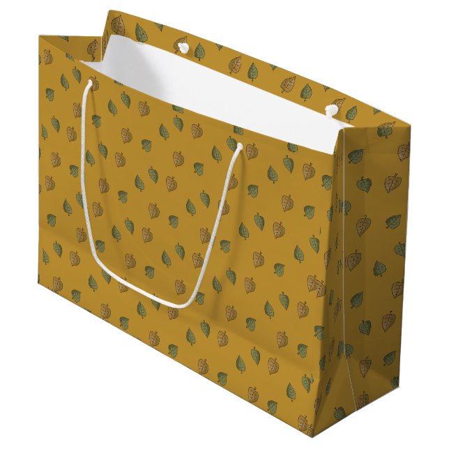 Gemusterte Geschenktasche mit gelber Blätter Große Geschenktüte (Vorderseite Schrägansicht)