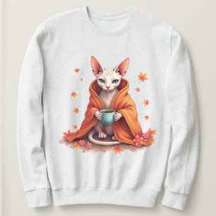 Gemütliche Sphynx-Katze in Decke gewickelt mit Kaf Sweatshirt