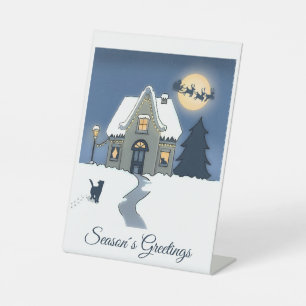 Gemütliche Weihnachtsszene mit House and Cat in Sn Sockelschild