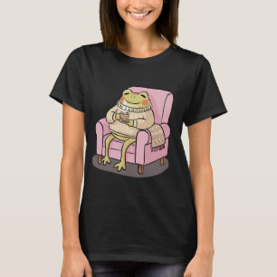 Gemütlicher Frosch, der auf dem Sofa Tee trinkt, I