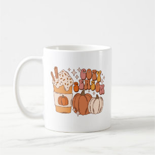 Gemütliches Kürbisgewürzgetränk und Kürbisse Kaffeetasse