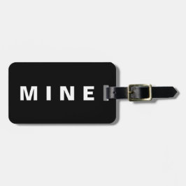 Gepäckanhänger mit dem Aufkleber "Mine"