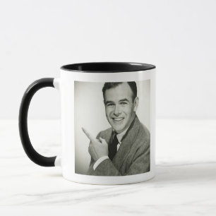 Geschäftsmann zeigt tasse