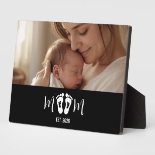 Geschenk mit Fußabdrücken des Babys und Gründungsd Fotoplatte