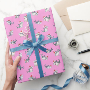 Geworfene Weihnachtshai auf Rosa Geschenkpapier