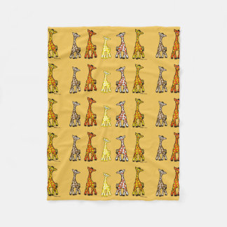 Girafes de bébé dans une couverture d'ouatine de