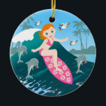 Girl Surfing Big Wave with Dolphins Keramikornament<br><div class="desc">This design features a cute girl surfing a big wave in the company of dolphins. On the horizon, there’s a tropical island. Seagulls are following her closely! Every summer day is a party for kids on the beach. The seaside is the place to go and have fun with friends, maybe...</div>