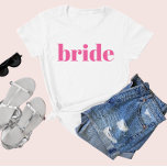 Girly Pink Retro Modern Bride Bachelorette T-Shirt<br><div class="desc">Spaß,  kokett rosa mit einfacher vertikaler Blockschrift,  um jedem Gast am Junggeselinnen-Abschied zu geben. Hübsche Sake Gunst für Ihre Lieblingsbriefe! Nachricht,  wenn du etwas Anderes will als das,  was du hier siehst-glücklich,  etwas für dich maßgeschneidert zu schaffen.</div>