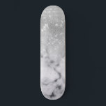 Glamour Silver Glitzer White Marble Ombre Skateboard<br><div class="desc">Dieses elegante und glamouröse Design ist perfekt für die trendige und stilvolle Frau. Es zeigt ein Imitat, das funkelnd silberne Glitzer-Sequenz und weiß mit schwarzem Marmorstein Muster ombre Farbverlauf gedruckt. Es ist modern, mädchenhaft, hübsch und cool. ***WICHTIGE HINWEIS FÜR DESIGN: Für individuelle Designanfragen, wie z.B. passende Produktanfragen, Farbänderungen, Platzierungsänderungen oder...</div>