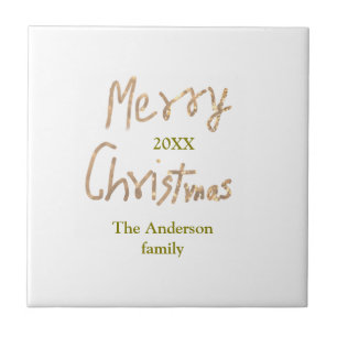 Glänzendes goldenes frohe Weihnachten Familienname Fliese