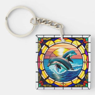 Glasmalerei mit Delfinen, die bei Sonnenuntergang  Schlüsselanhänger