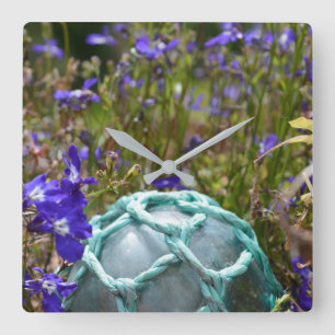 Glass Fishing Float And Flowers Quadratische Wanduhr