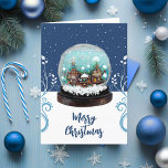 Glass Snowball Winter Village Blue Christmas Feiertagskarte<br><div class="desc">Glass Snowball Winter Village Snowflakes Blue Weihnachtskarte. Märchenhäuser im Winter mit Schnee und schönen Schneeflocken. Schöne Pflanze mit weißem und blauem Klettern. Ein froher Weihnachtswunsch in einem trendigen Drehbuch. Sie können den Text ändern.</div>