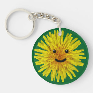 Glückliche gelbe Sommer-Löwenzahn-Blume auf Schlüsselanhänger