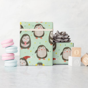 Glückliche Pinguine mit Weihnachtsmannmützen und O Geschenkpapier