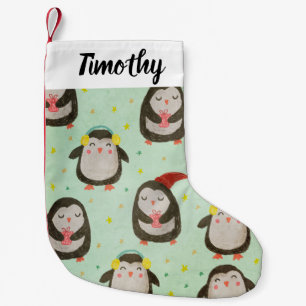 Glückliche Pinguine mit Weihnachtsmannmützen und O Kleiner Weihnachtsstrumpf
