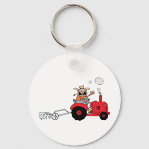 Glücklicher Bauer, der einen Traktor verwendet Schlüsselanhänger
