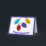 Glückliches Chanukah Dreidels Feiertagskarte<br><div class="desc">Vier Chanukah Dreidels in den hellen Farben mit den Wörtern glückliches Chanukah darunterliegend</div>