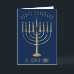 Glückliches Chanukah GoldMenorah blaue Feiertagskarte<br><div class="desc">Schicken Sie Ihren geliebten eine personalisierte Karte diese Chanukah Jahreszeit. Dieses Ausrüstungsbeschreibungen ein Gold färbten menorah auf einem Marineblauhintergrund. Über ihr liest die Mitteilung "glückliches Chanukah". Unterhalb des menorah ist ein Platz für Ihren Familiennamen, den Sie personifizieren oder entfernen können, wenn Sie möchten. Innerhalb der Karte liest "den Wunsch Ihnen...</div>