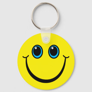 Glückliches gelbes Emoji stellen gegenüber Schlüsselanhänger