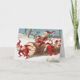 Gnomes dragging a cut tree trunk through the snow karte