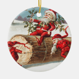Gnomes dragging a cut tree trunk through the snow keramik ornament