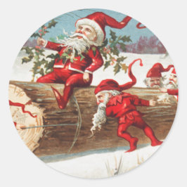 Gnomes dragging a cut tree trunk through the snow runder aufkleber