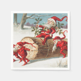 Gnomes dragging a cut tree trunk through the snow serviette