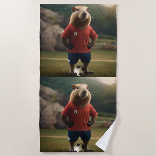 "Goal-Scoring Capybara: Der ultimative Fußballstar Strandtuch (Vorderseite)