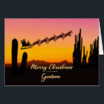 Godson Christmas Santa Over Wüste<br><div class="desc">Eine Weihnachtskarte für Ihren Sohn,  die dem Weihnachtsmann zeigt,  der über die Wüste fliegt. In der Silhouette sind viele große Kakteen zu sehen. Wünschen Sie ein frohes Weihnachtsfest aus der Wüste mit einer schönen Sonnenuntergang farbenen Karte.</div>
