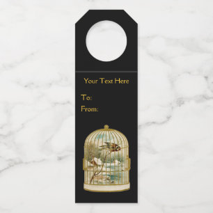 Gold Birdcage mit Vogel in der Zweigkabine Flaschenanhänger