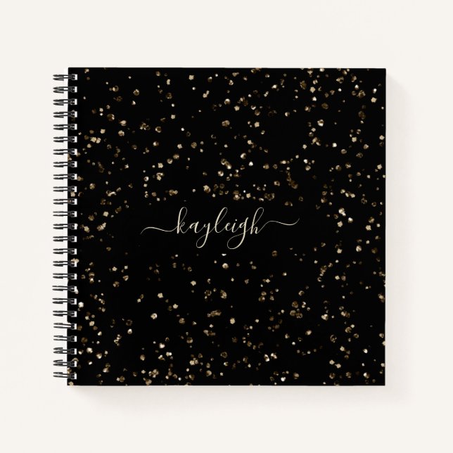 Gold-Glitzer-Staub auf schwarzem Notebook Notizbuch (Vorderseite)