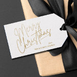 Gold Merry Christmas Luxe Geschenkanhänger<br><div class="desc">Frohe Weihnachten in einem Imitat goldene Folienskript und Ihre Namen in schicken Schriften,  diese weißen Geschenketiketten oder Gastgeschenk Tags sind stilvoll für jeden Weihnachtsfeiertag. PASSENDE Artikel in unserem Geschäft.</div>