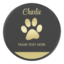 Gold Shiny Dog Paw auf schwarzem Hintergrund Eishockey Puck