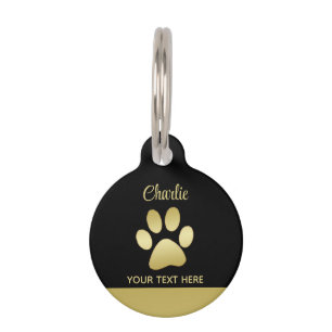 Gold Shiny Dog Paw auf schwarzem Hintergrund Haustiermarke