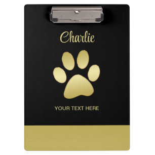 Gold Shiny Dog Paw auf schwarzem Hintergrund Klemmbrett