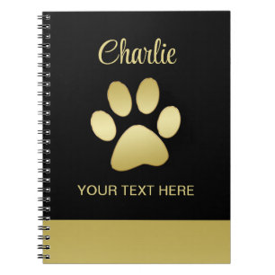 Gold Shiny Dog Paw auf schwarzem Hintergrund Notizblock