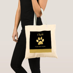 Gold Shiny Dog Paw auf schwarzem Hintergrund Tragetasche