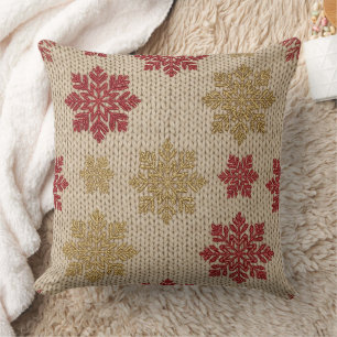 Gold- und Rot-Schneeflocken-Strickmuster auf Creme Kissen