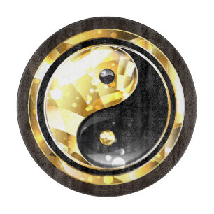 Gold Yin Yang auf schwarz Schneidebrett