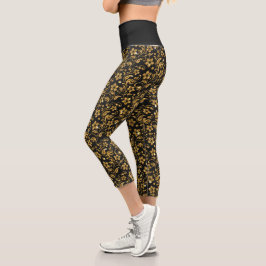 Goldbarock-Blume auf den Leggings der Schwarzen Ca