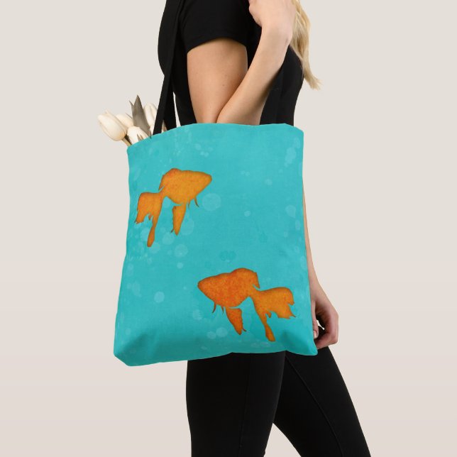Goldbarsch-orangefarbene Silhouetten im türkisfarb Tasche (Von Nahem)