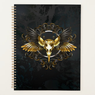Golden Bird Skull auf schwarzem Hintergrund Planer