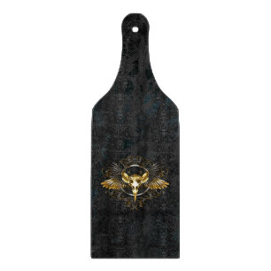 Golden Bird Skull auf schwarzem Hintergrund Schneidebrett